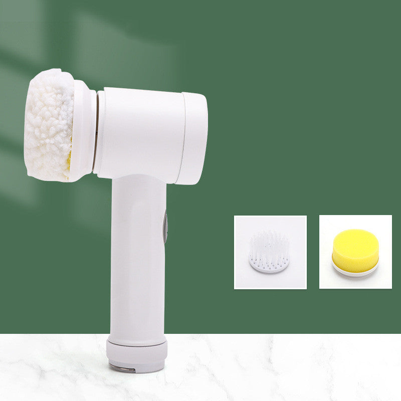 White facial cleansing brush with interchangeable heads on a green background