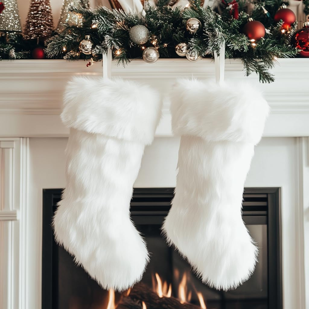 White fluffy stockings hanging on a fireplace with Christmas decorations above.