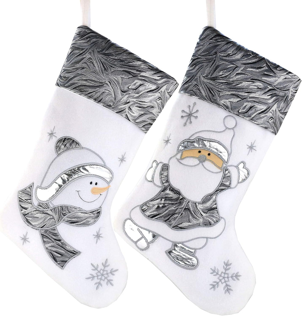 Two Christmas stockings with silver designs of a snowman and Santa Claus on a white background.
