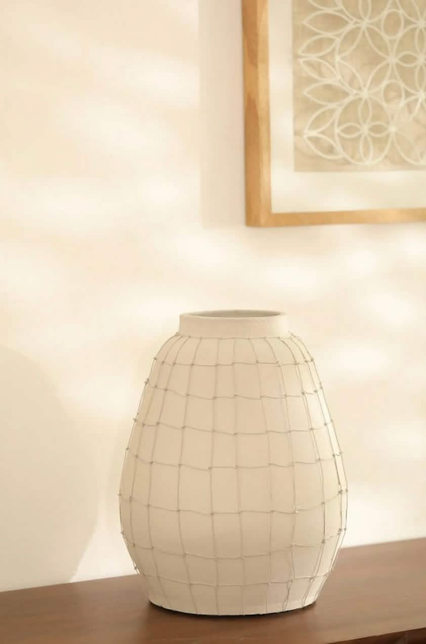 Rustic clay vase with artistic wire detailing HTrend
