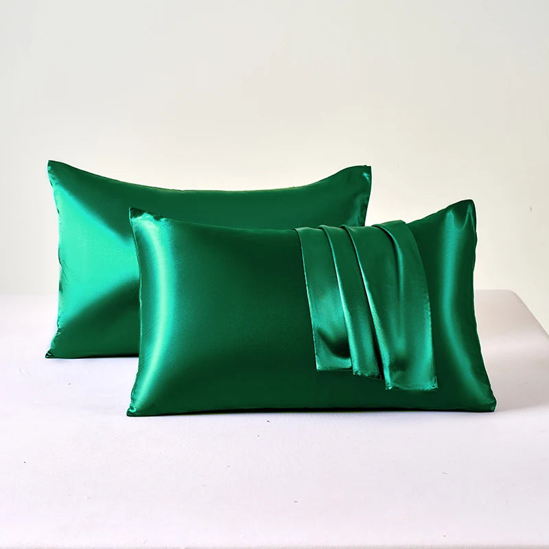 Two green satin pillows 