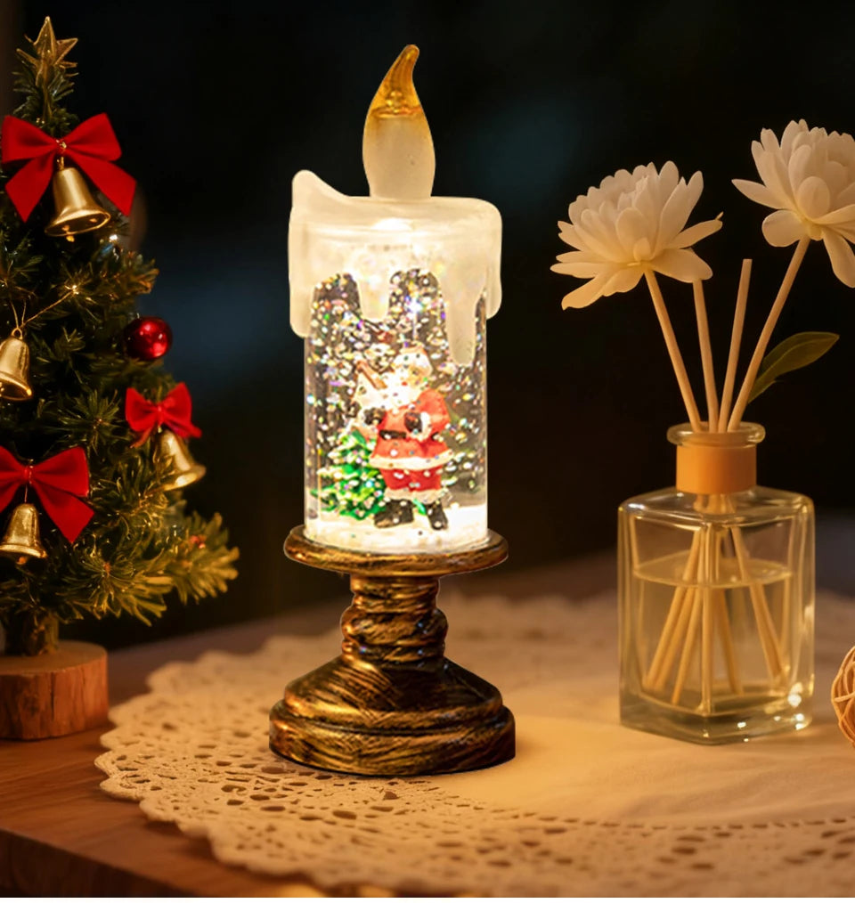Decorative candle with Santa Claus figure inside, Christmas tree, and diffuser bottle on a table.