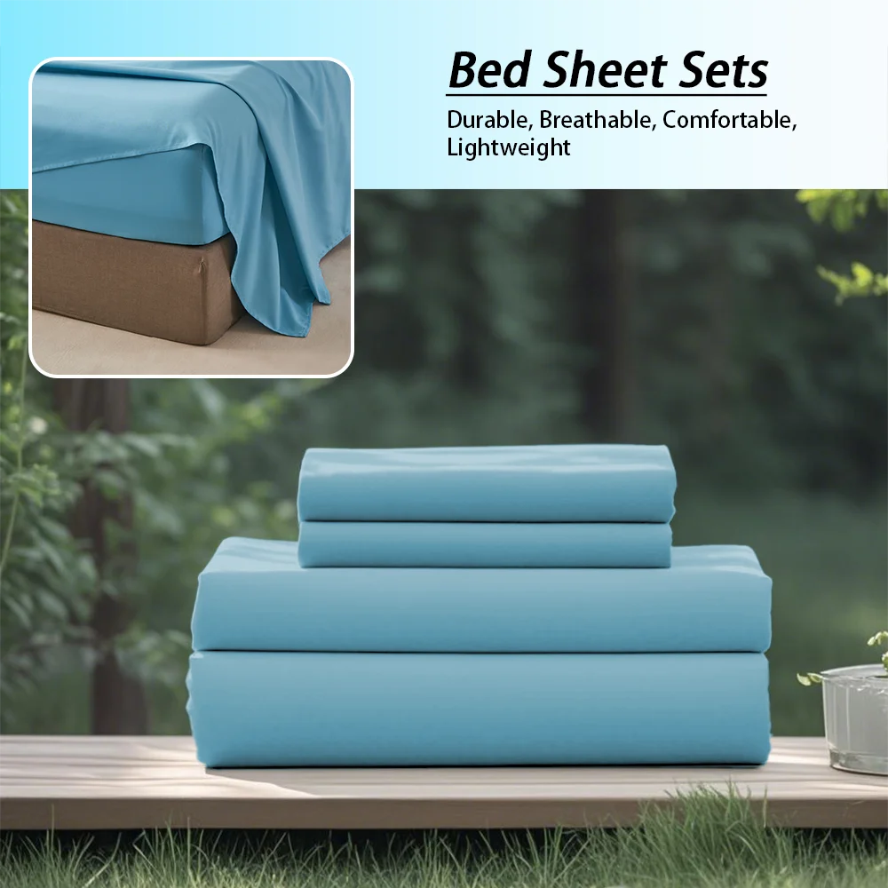 Stack of blue bed sheets with a blurred green outdoor background