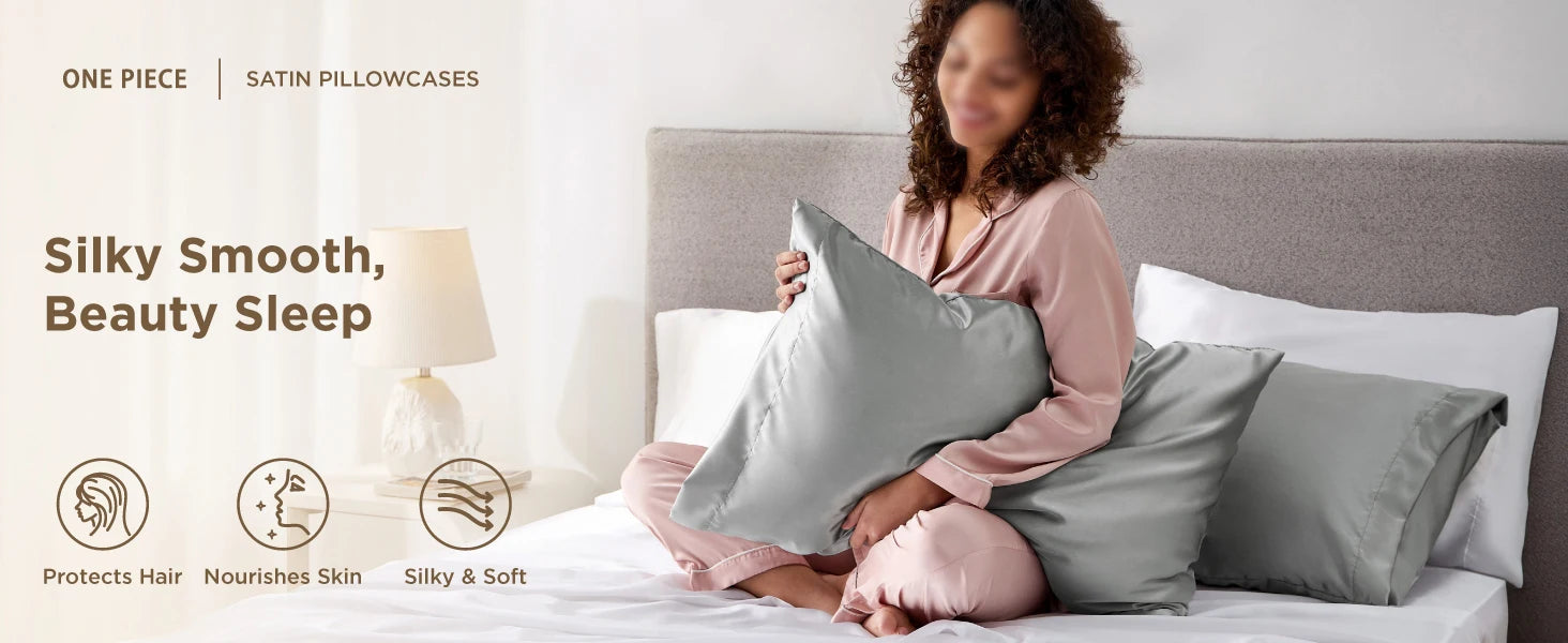 Woman holding a satin pillowcase with text about pillowcases on a bed.