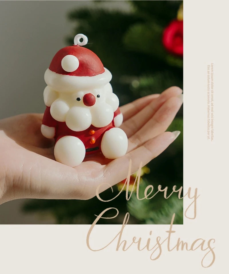 Small Santa Claus figurine held in a hand with a blurred Christmas tree background