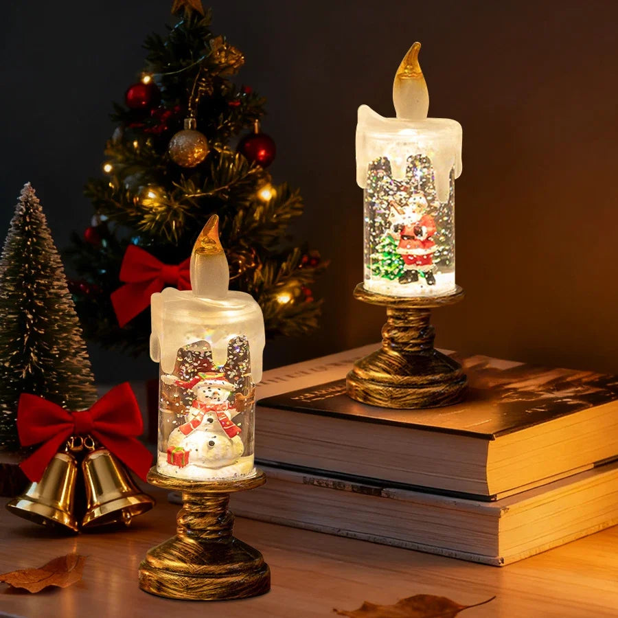 Decorative candle lights with Christmas-themed designs on books in front of a decorated tree.