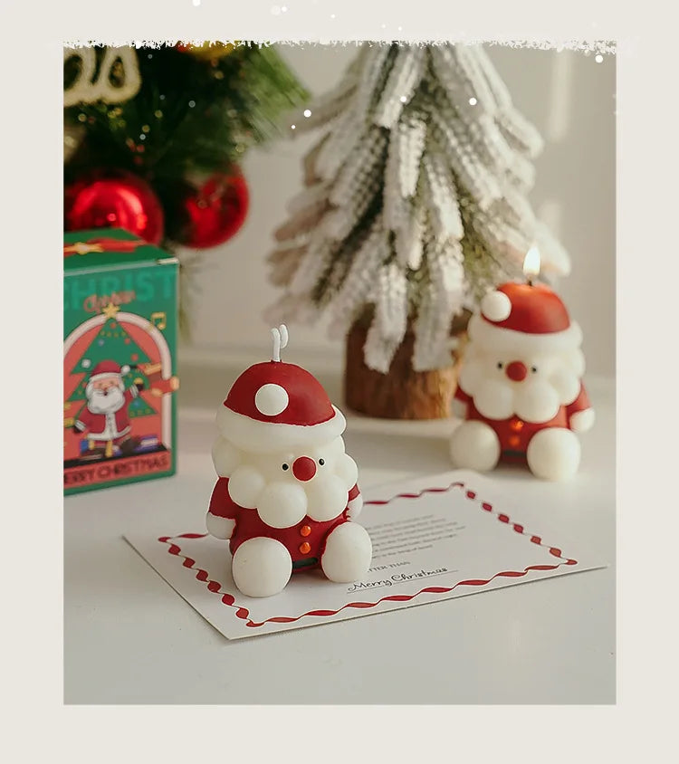 Santa Claus candle on a table with Christmas decorations 