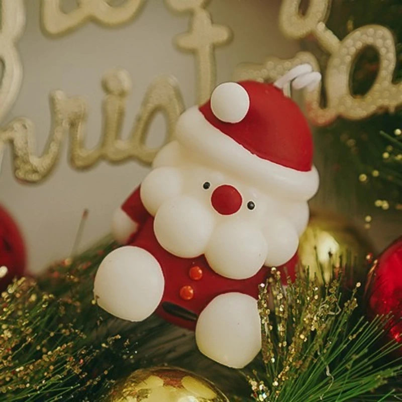 Small Santa Claus Christmas tree ornament with festive holiday decorations and warm lights