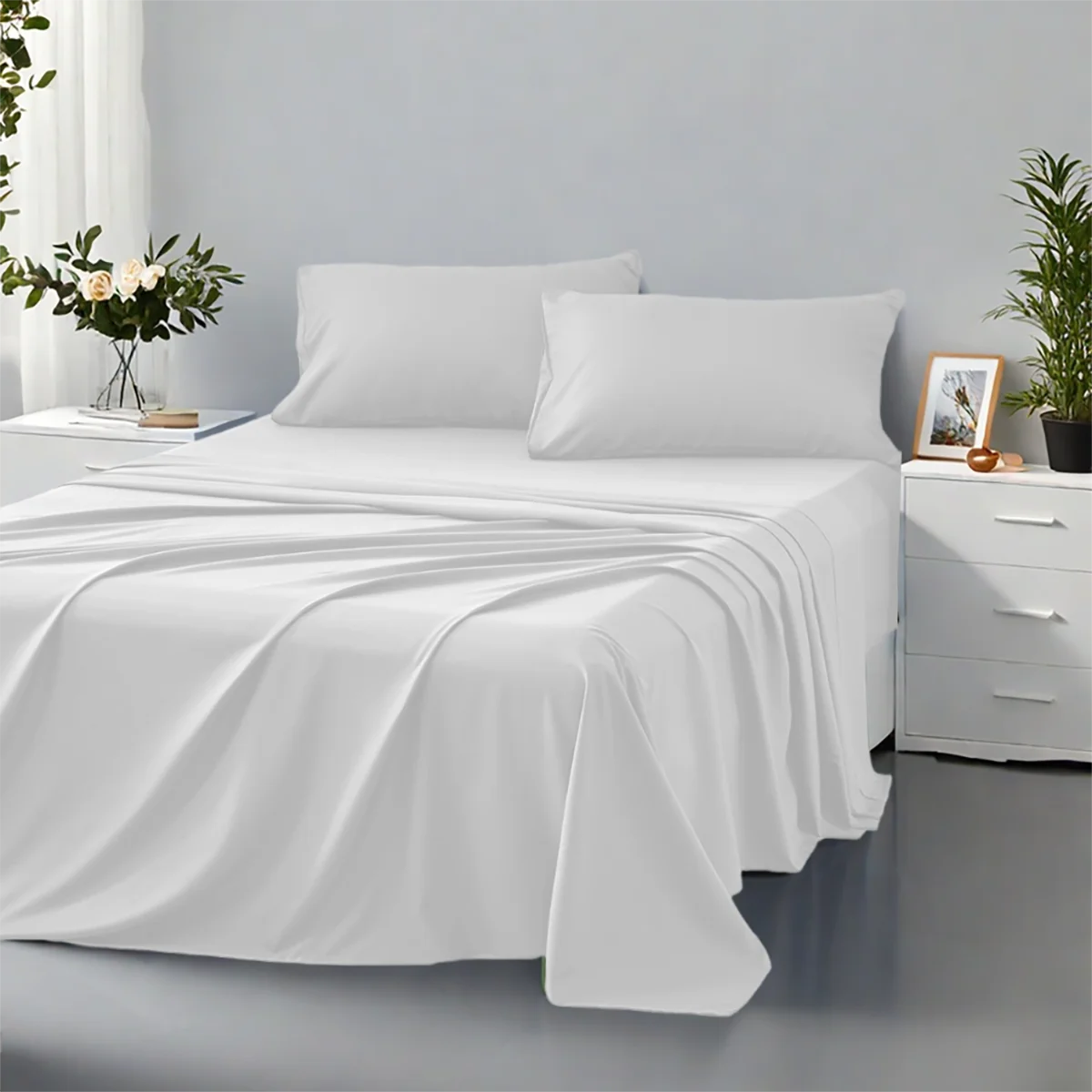 White bed sheets and pillows on a bed in a bedroom setting with plants and decor.