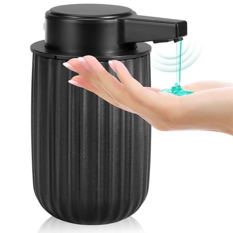 Black soap dispenser with ribbed design dispensing liquid into a hand.