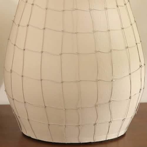 Decorative white ceramic vase with a grid pattern and silver accents.