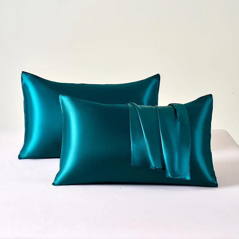 Teal Silk Pillowcases featuring a smooth, shiny texture for luxurious comfort.